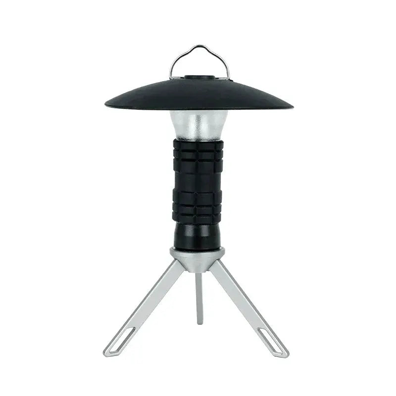 Portable camping lantern by Simples Market with black body and silver tripod legs