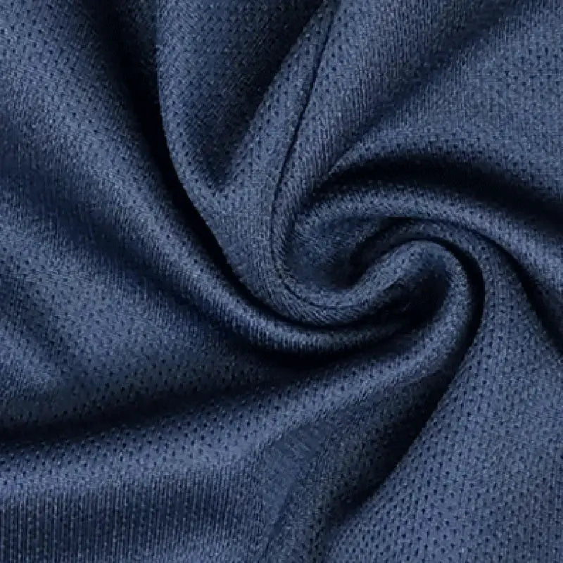 Men's running shorts in navy blue mesh fabric, close-up texture