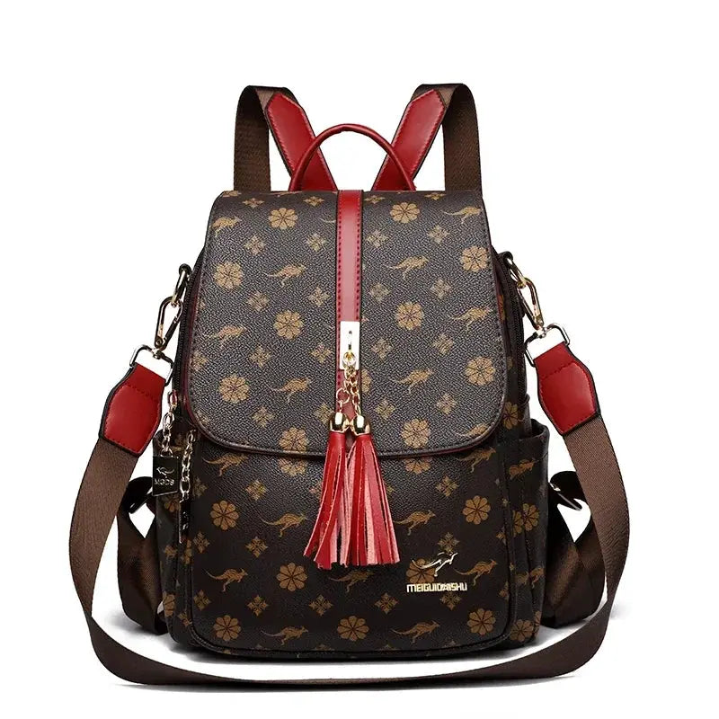 Ladies designer leather backpack with brown floral print, red tassel and trim, large capacity