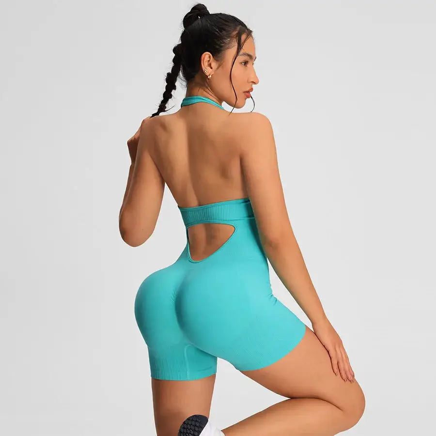 Simples Market turquoise women's gym romper jumpsuit with back cutout and shorts.