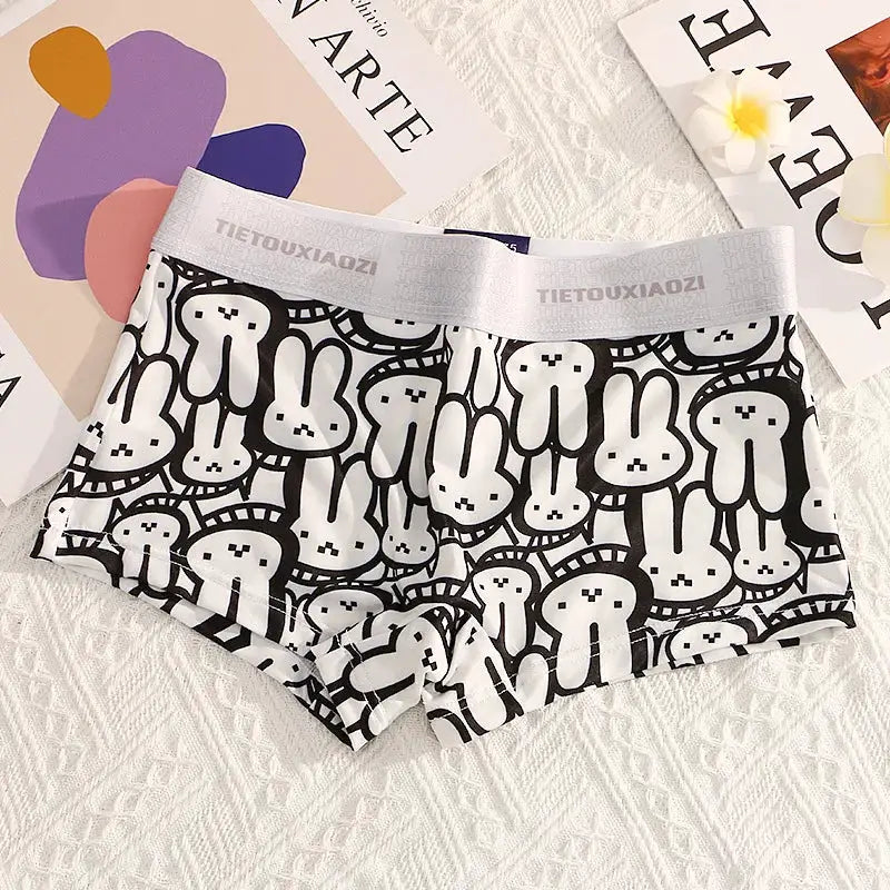 Women's seamless boyshort underwear in black and white cartoon bunny print with white elastic waistband.