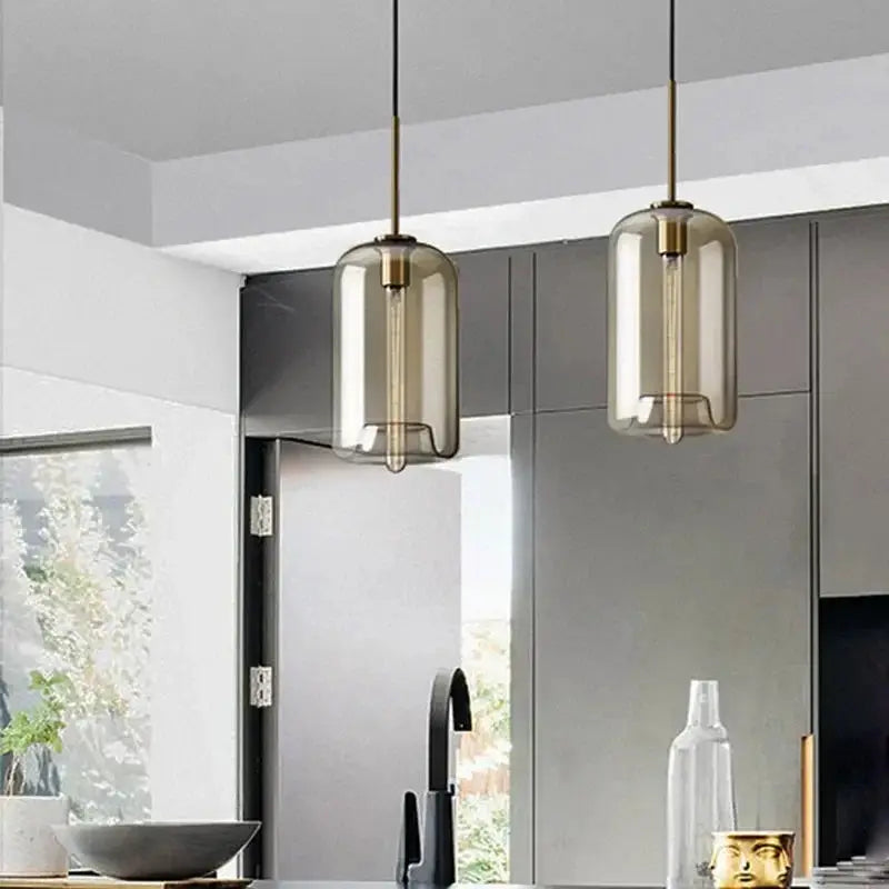 Nordic LED smoked-glass pendant lights, two amber domes with brass fixtures