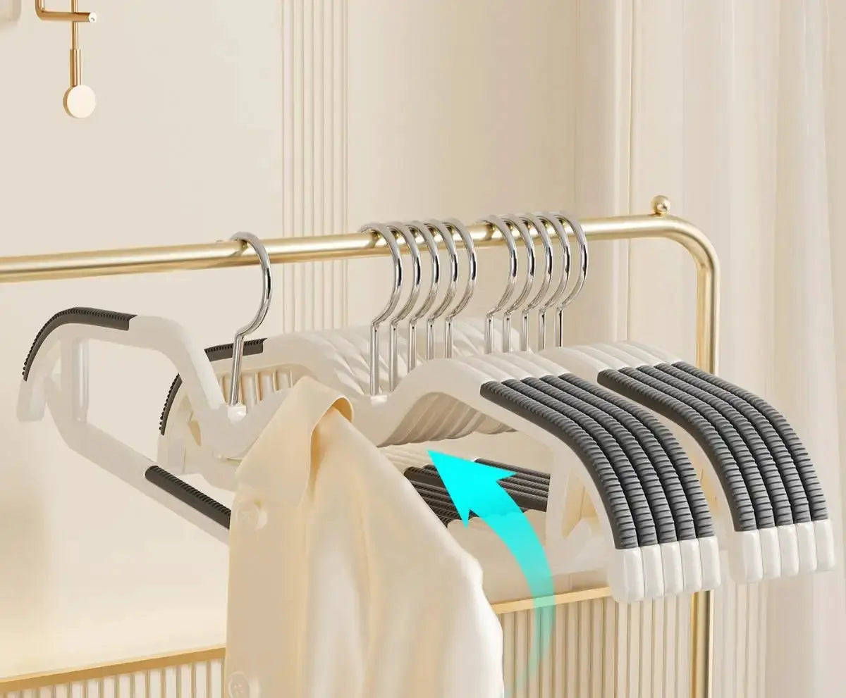 Short-neck non-slip clothes hangers by Simples Market on a gold rack; space-saving neck-narrowing, anti-shoulder design