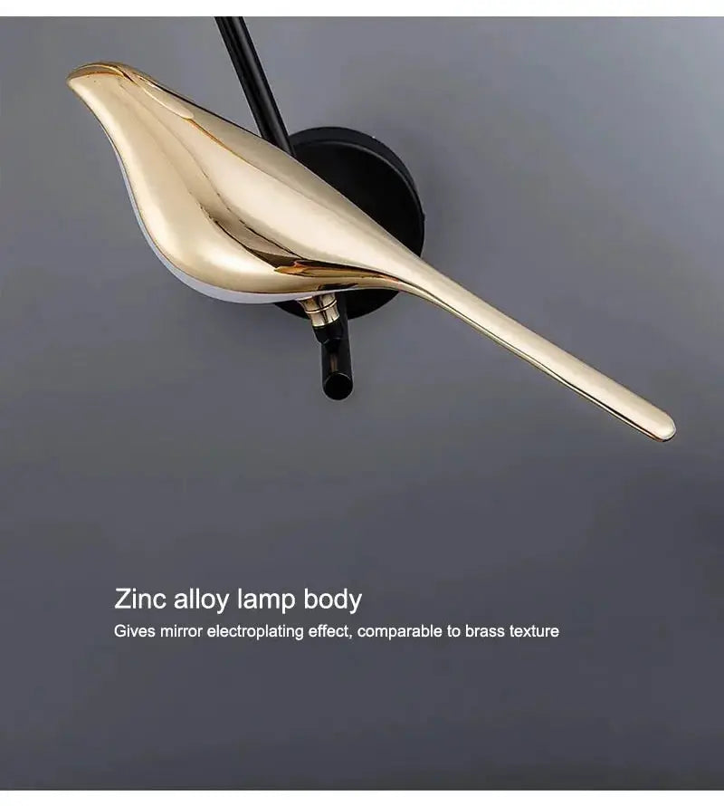 Magpie bird LED wall lamp by Simples Market; zinc alloy body with gold finish.