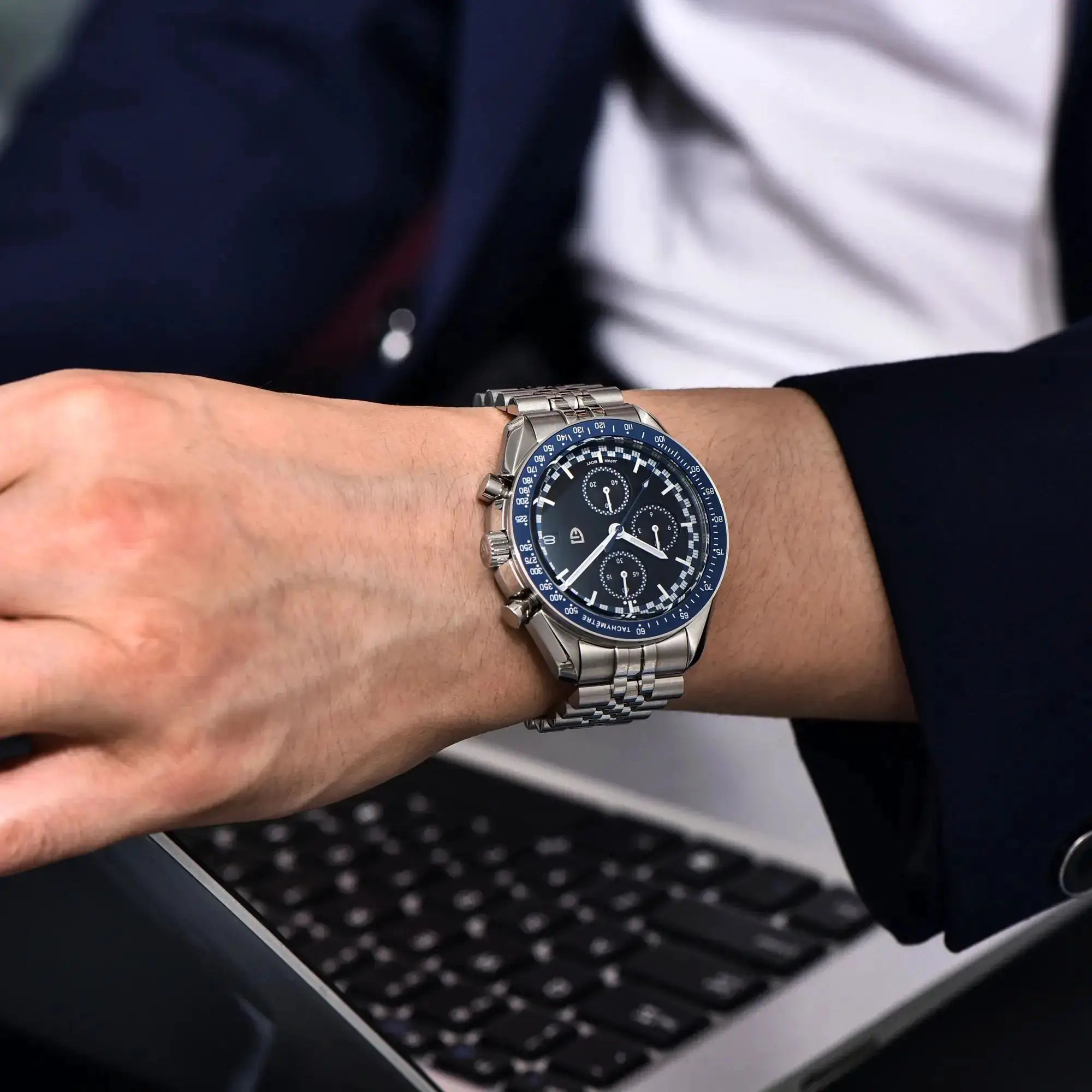 Pagani Design men's sport chronograph watch with blue bezel and black dial on stainless steel bracelet
