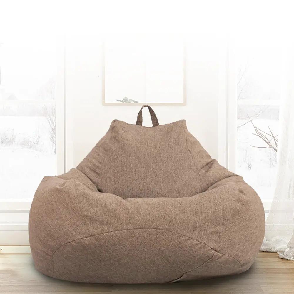 Bean bag chair in brown plush fabric, adult lounger for living room or bedroom.