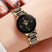 Fashion rhinestone women's watch by Simples Market with Orlando logo on black dial and gold-tone link band