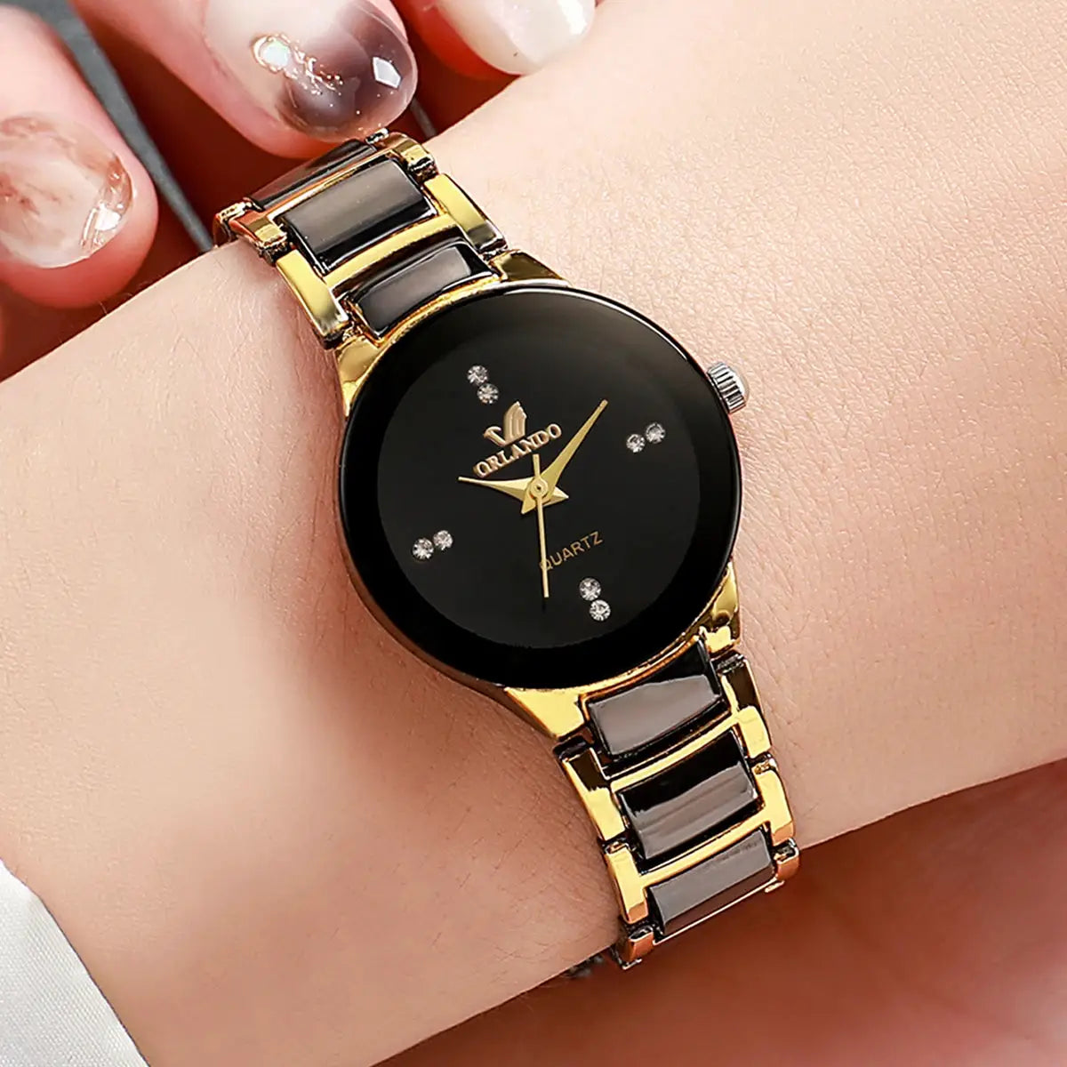 Fashion rhinestone women's watch by Simples Market with Orlando logo on black dial and gold-tone link band