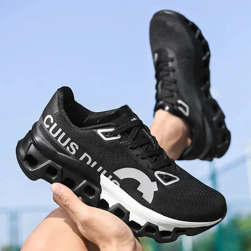 Pair of men's black breathable-mesh running shoes with a chunky hollow-out sole and non-slip outsole.