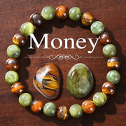 Prosperity and Abundance Healing Bracelet with green and amber gemstone beads and tiger's eye centerpiece