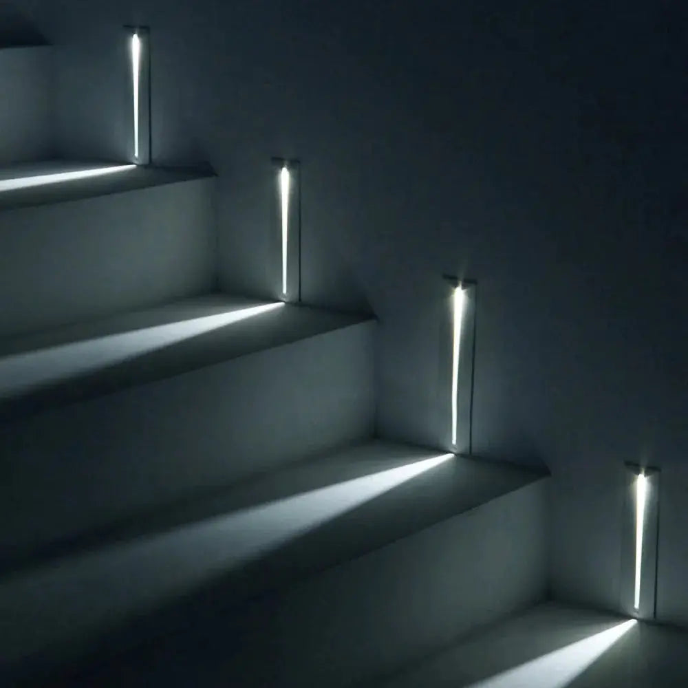 SANDI smart stair lighting wall lamp; four recessed motion-sensor white LED step lights by Simples Market.