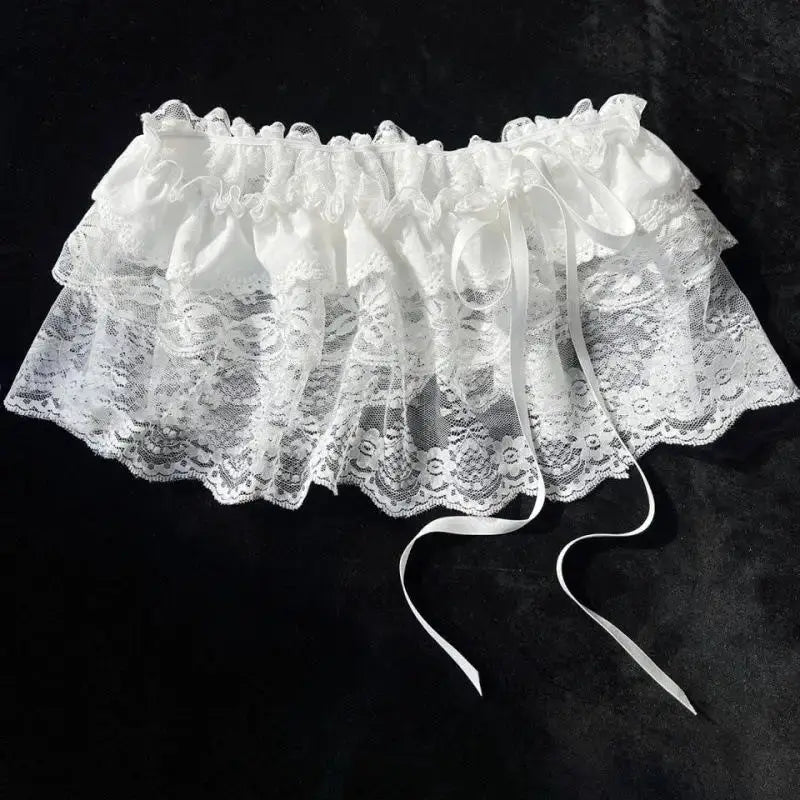 White lace layered gauze mini skirt with ruffle waist and satin ribbon ties