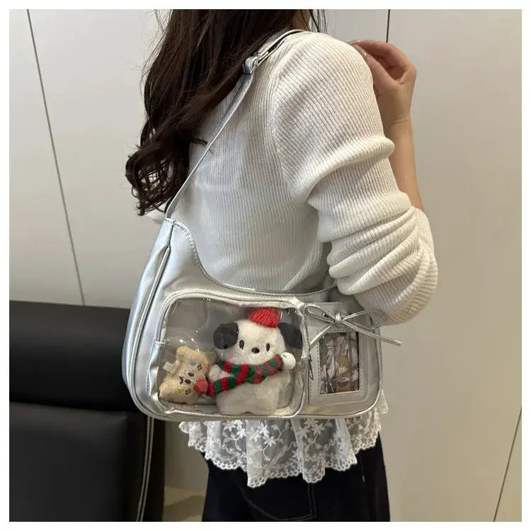 Y2k Harajuku shoulder bag with transparent front panel, silver-blue; two plush toys visible inside.