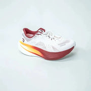 Men's running shoe by Simples Market, white mesh upper with red accents and a gradient orange-red midsole.