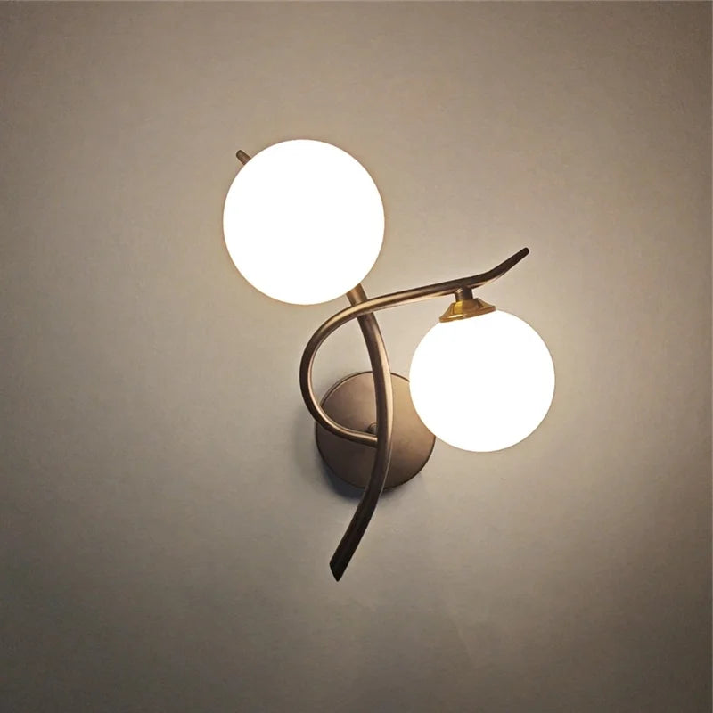 Nordic metal wall lamp with two glass globe bulbs in bronze finish by Simples Market