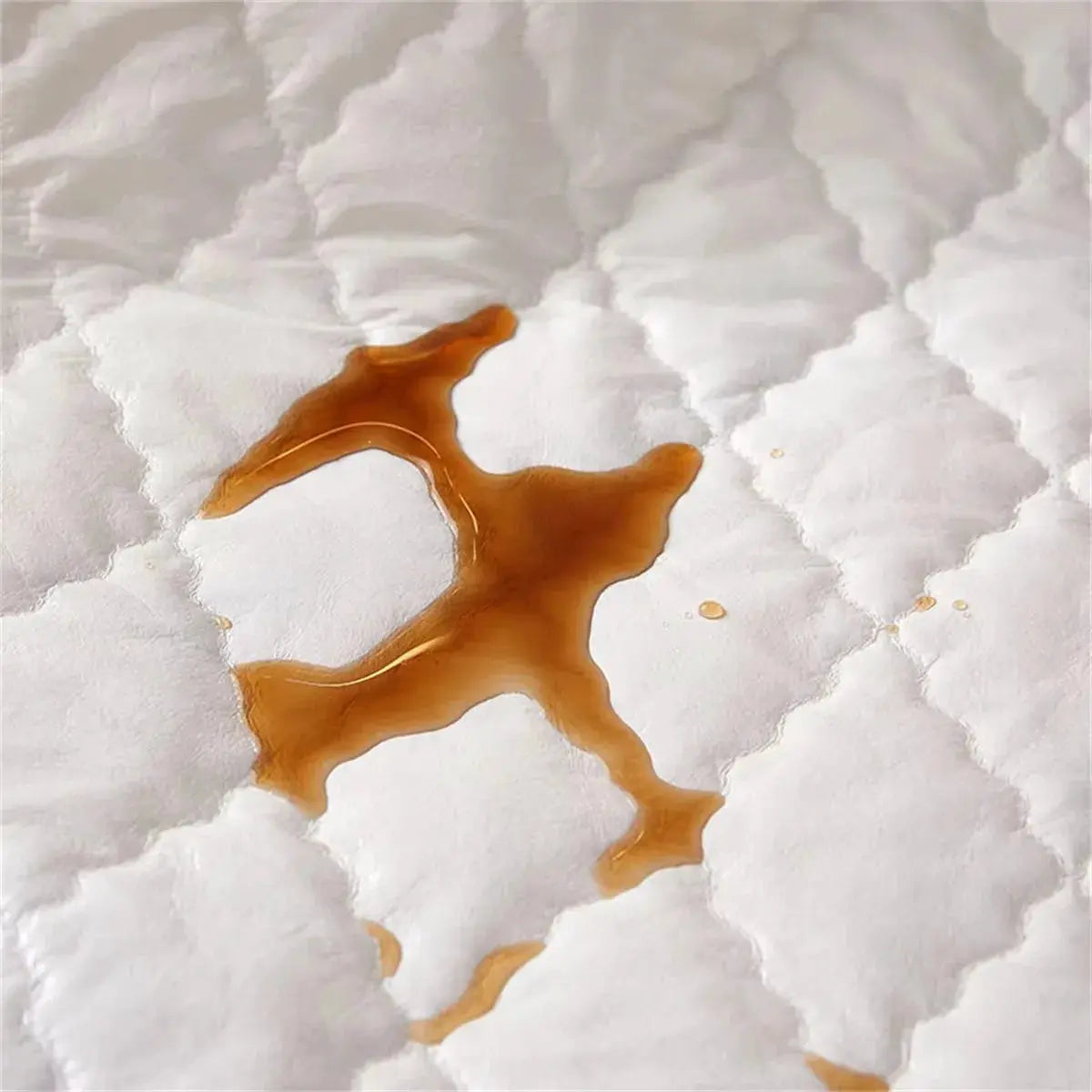 Double-deck pillowcase, white quilted cotton with brown liquid stain.
