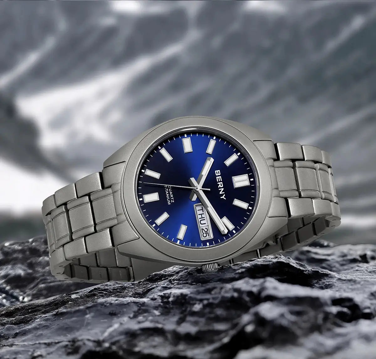 BERNY titanium men's watch with blue dial and silver bracelet.