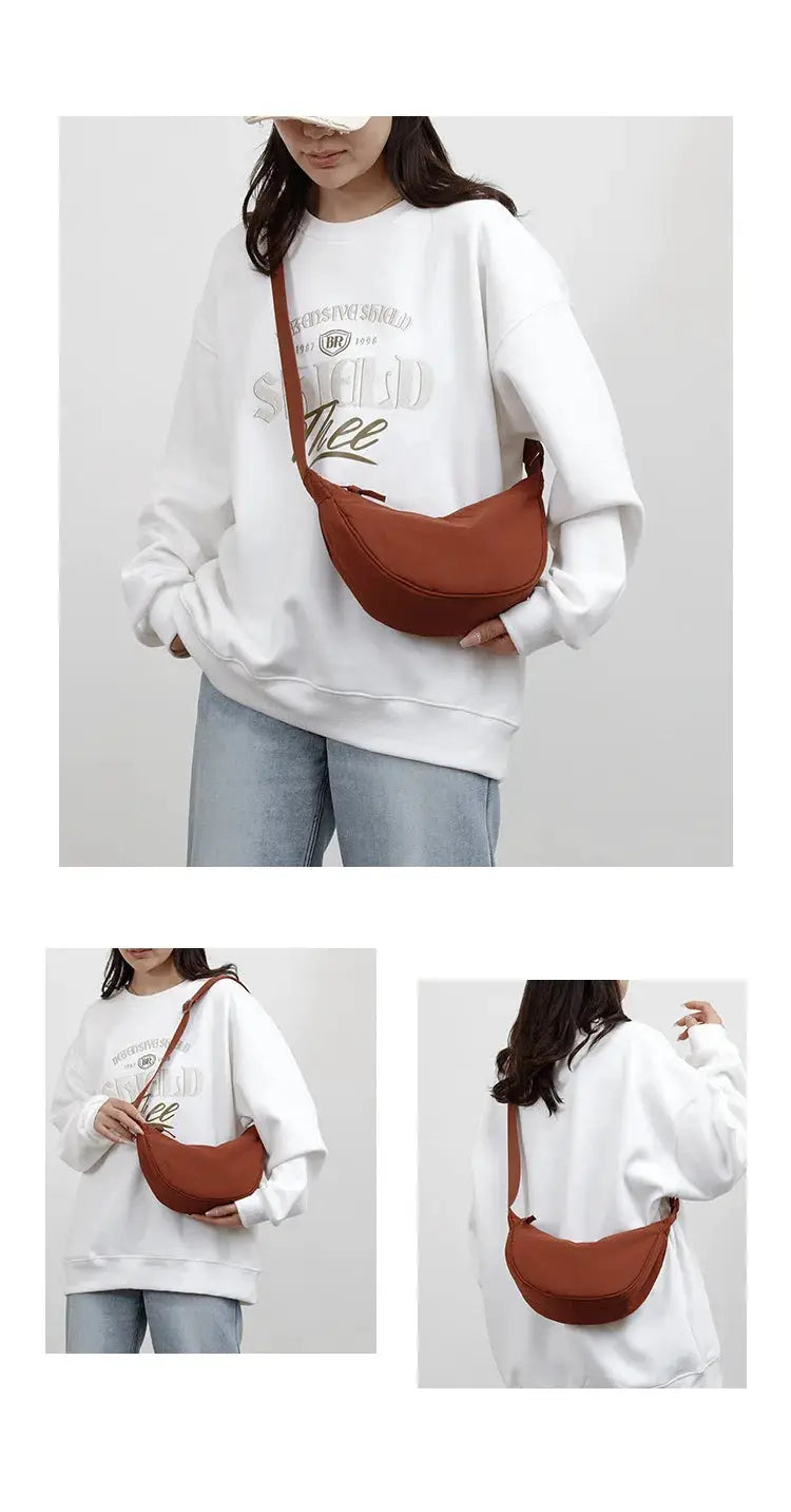 Simples Market nylon crossbody bag in rust brown, crescent-shaped dumpling style with zipper worn under the armpit