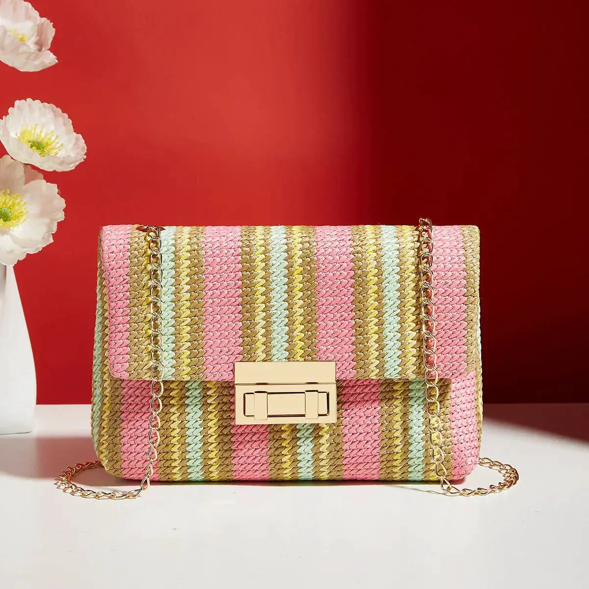 Crossbody bag for women by Simples Market; pastel pink, mint and gold woven straw with gold chain strap