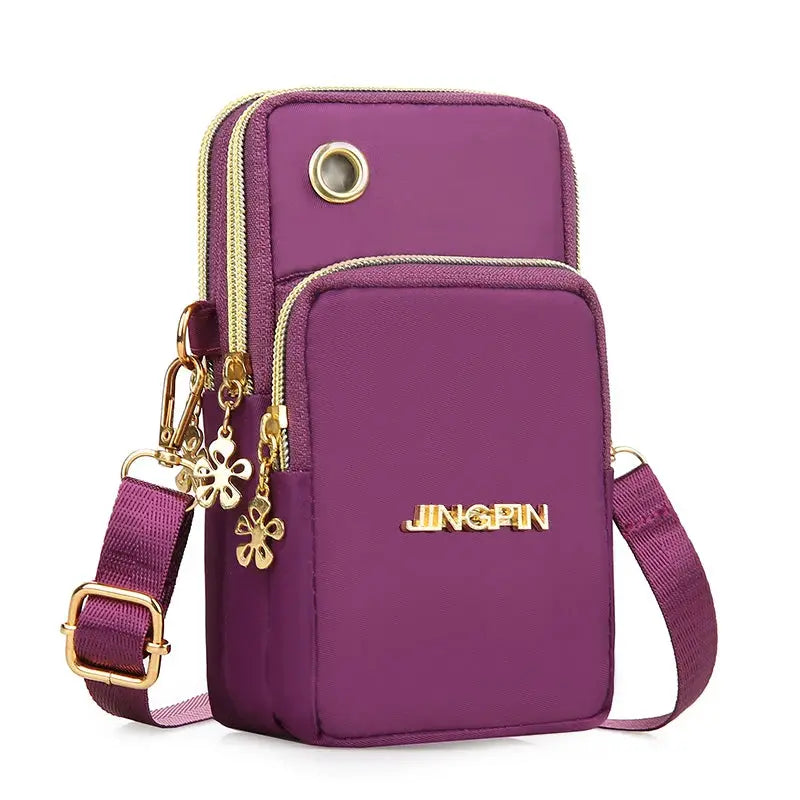 Purple mini crossbody phone bag by JINGPIN with gold zippers and floral charms