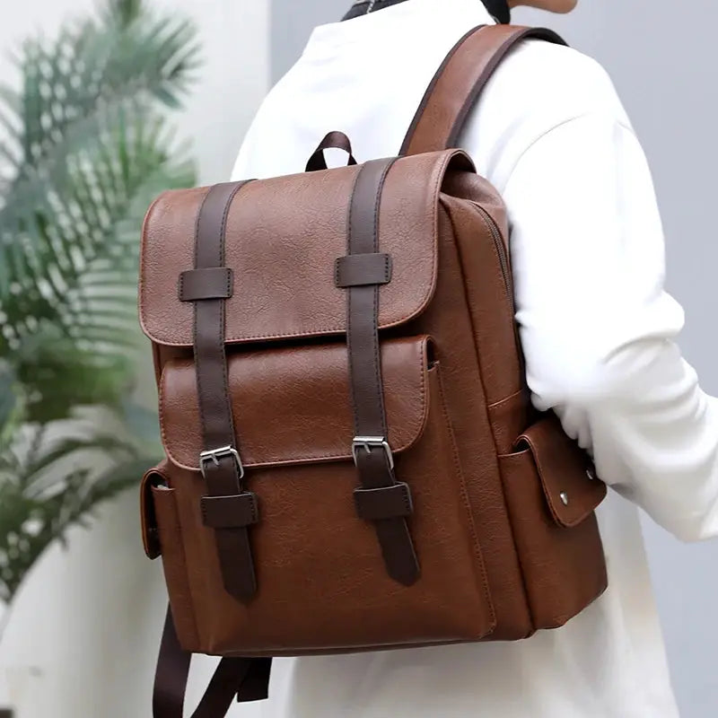Simples Market men's PU leather backpack in brown with large laptop compartment and buckle straps