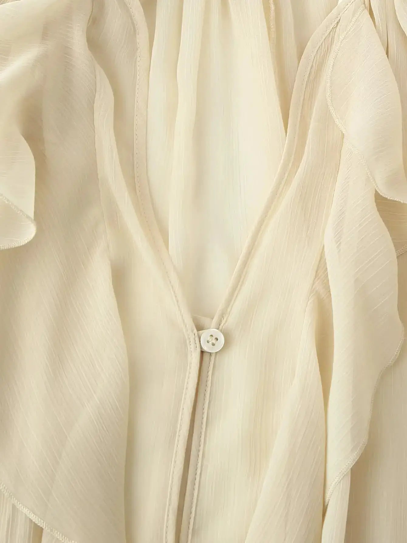 YENKYE ivory semi-sheer blouse with V-neck, front buttons and ruffle trim, long sleeves