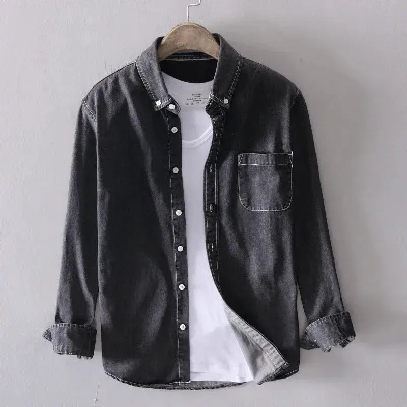 Men's dark wash denim shirt, long-sleeve, button-front with chest pocket, layered over a white tee