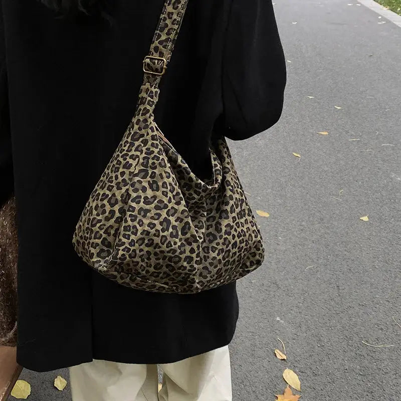 Leopard print soft textile shoulder bag with large capacity, crossbody style for commute and outings.