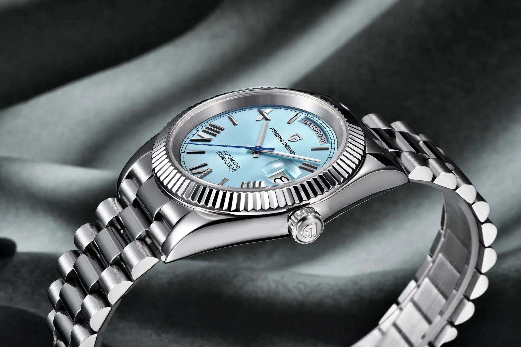 PAGANI DESIGN men's stainless steel automatic watch with light blue dial, day-date window, and fluted bezel.