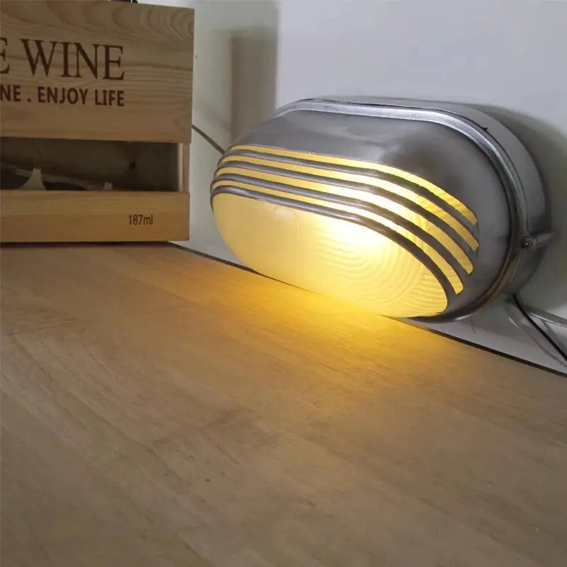 Outdoor retro LED wall lamp with oval metal housing and ribbed glass, IP65