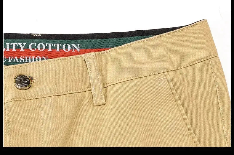 Men's khaki cotton casual pants with belt loop and button, waistband detail.