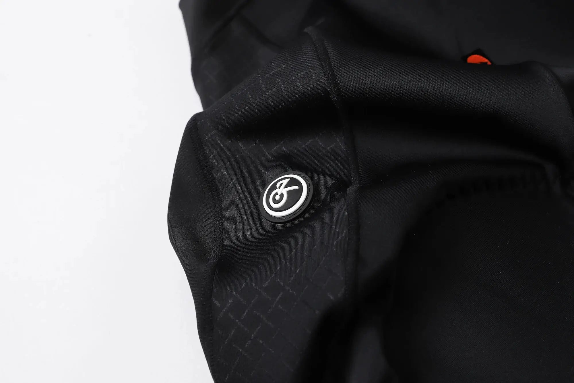 Men's cycling bib shorts in black with subtle grid texture and Simples Market logo badge.