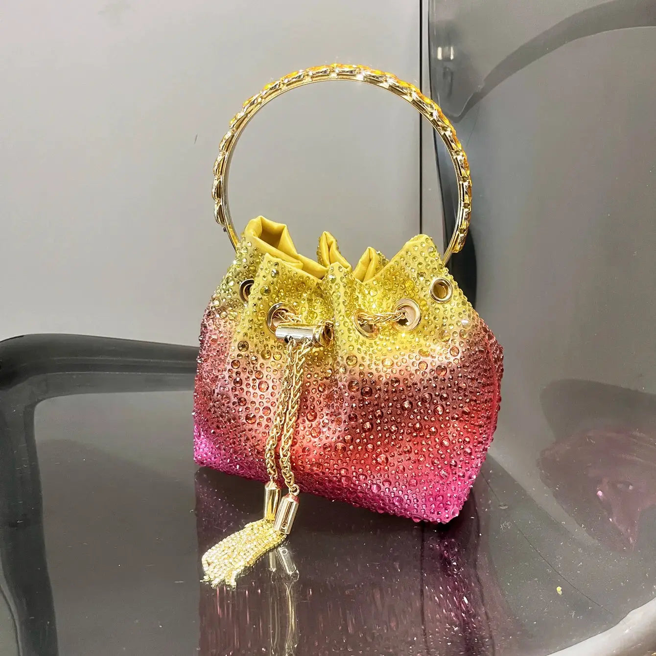 Simples Market rhinestone gradient evening clutch with crystal hoop handle and gold chain tassel