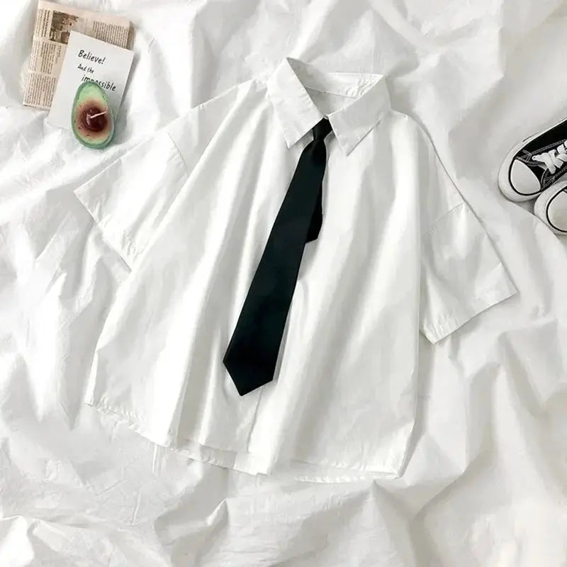 White women's short-sleeve blouse with lapel collar and black tie