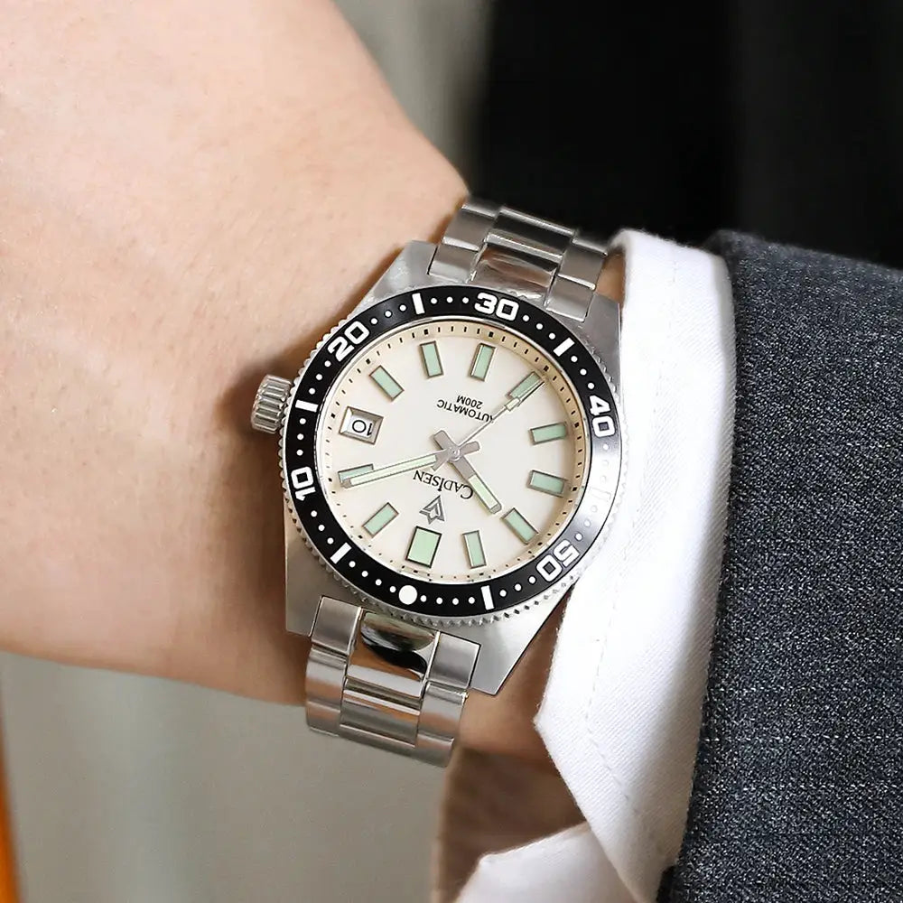 CADISEN 38mm diver watch with stainless steel bracelet, white dial, luminous markers, date window, black bezel, 100m