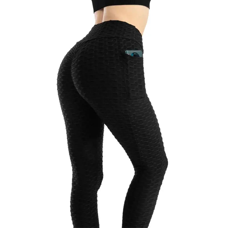 Women's black textured bubble-pocket leggings with high waist and back pocket, stretchy gym pants
