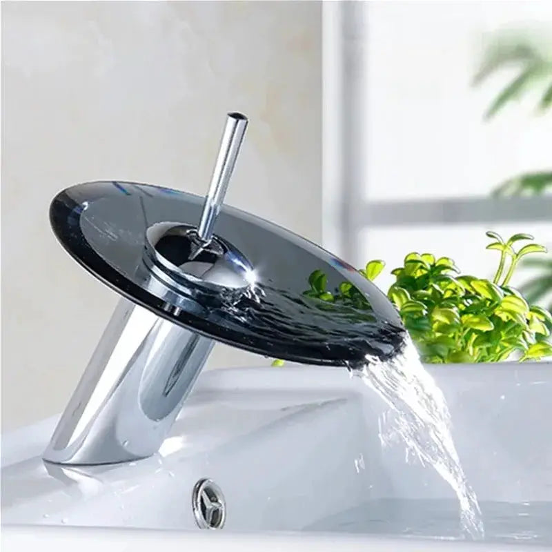 Bathroom waterfall faucet with glass disc, chrome finish, deck-mounted single-lever mixer tap.