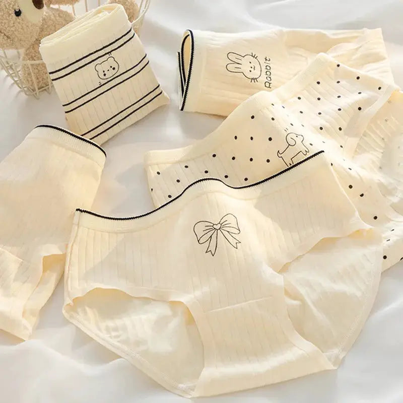 Five-piece cream cotton panties set with cartoon prints, bows, polka dots and stripes