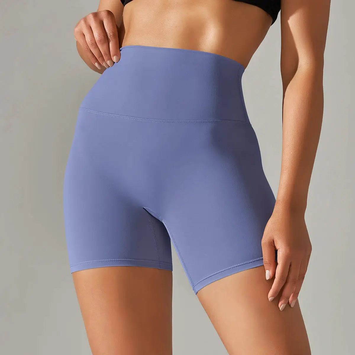 Women’s high-waisted lavender athletic shorts for yoga and gym workouts.