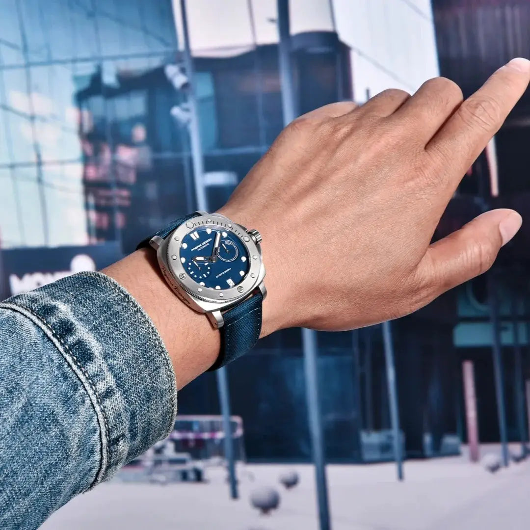 Pagani Design men's automatic watch with blue dial, stainless steel case, blue strap, and bold markers on wrist.