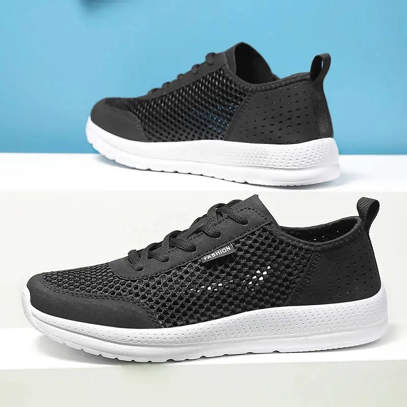 Men's breathable mesh sport shoes by Simples Market, black upper with white sole
