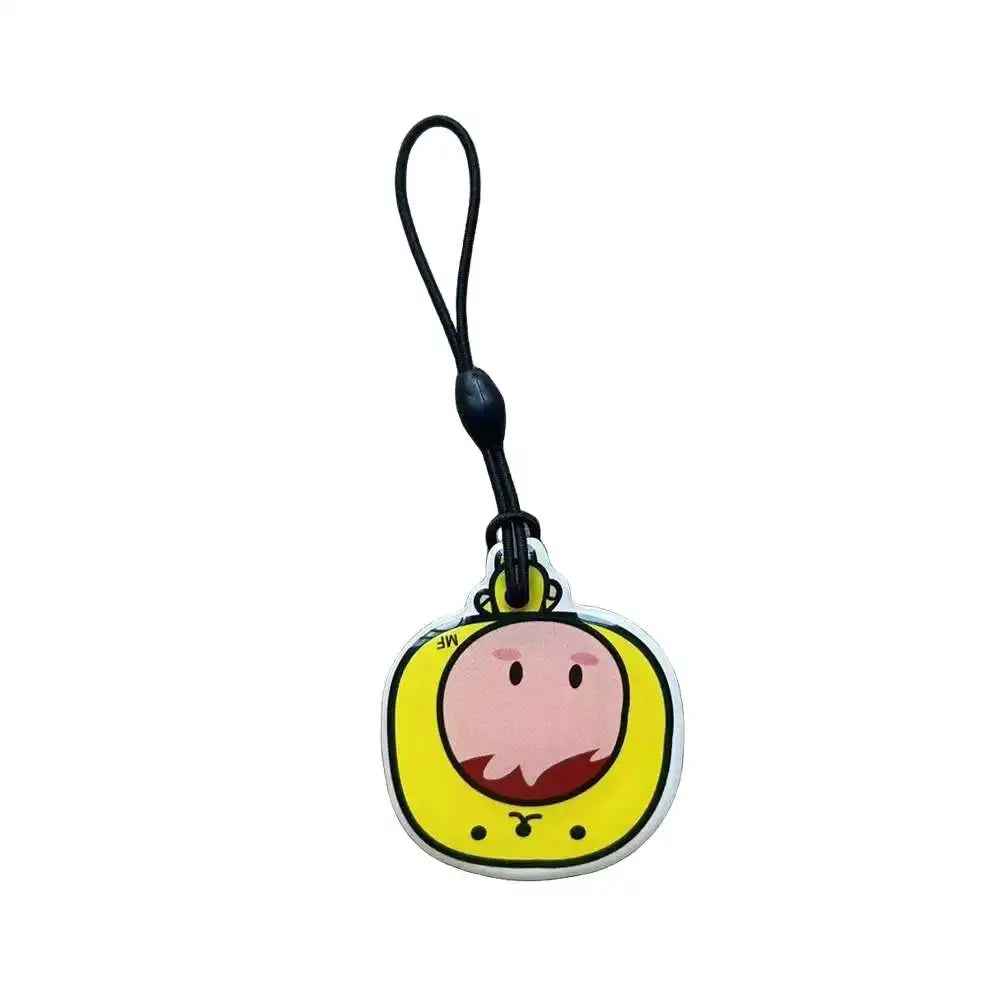 Simples Market RFID key tag keyfob, yellow round charm with pink cartoon face and black lanyard loop