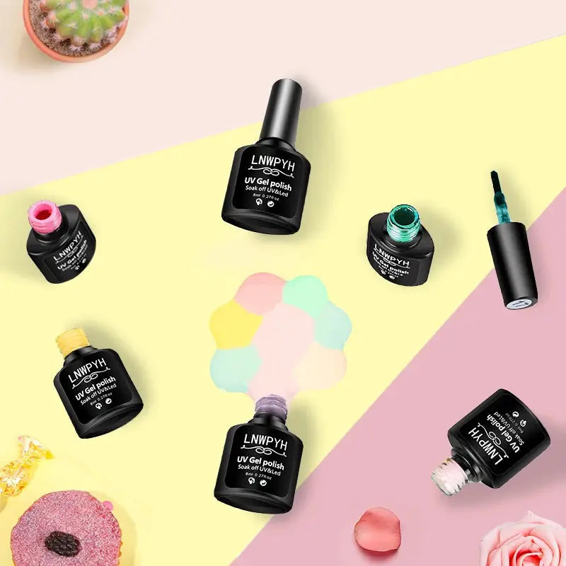 Gel nail polish kit with assorted colored gel bottles on pastel background