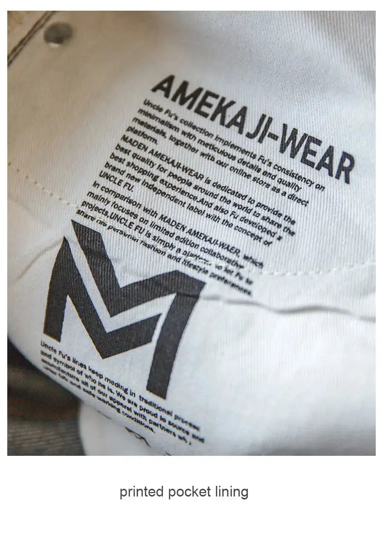 Maden Retro denim pocket lining with AmeKa J-Wear logo and bold M symbol on white fabric