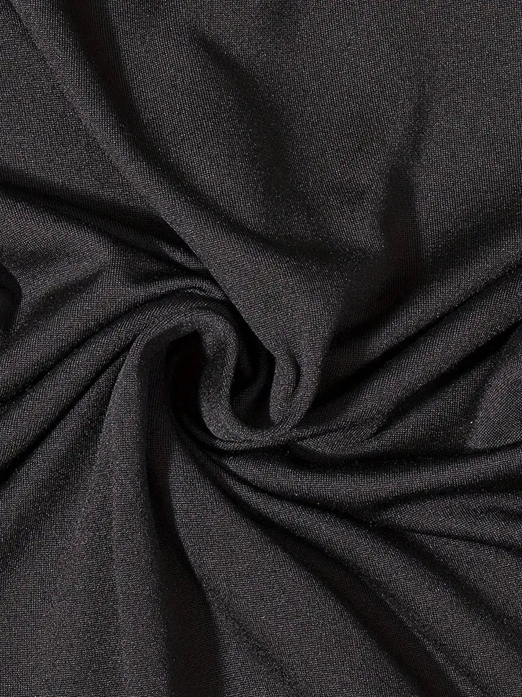 Simples Market women's romper fabric in black, close-up knit texture
