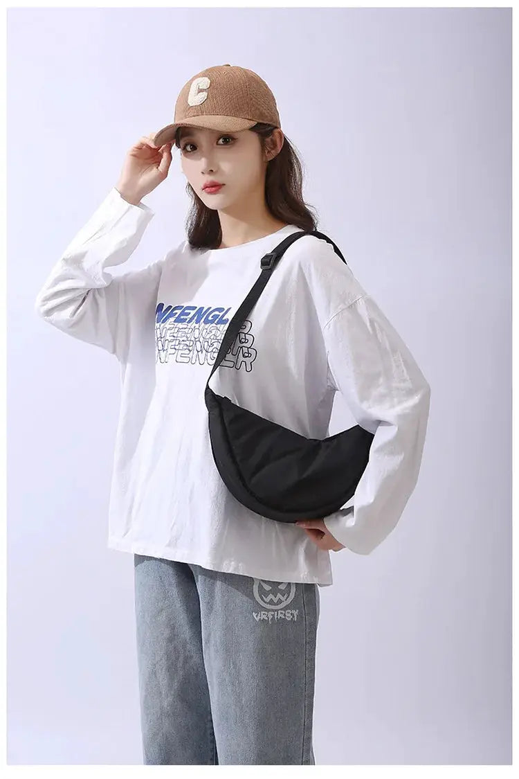 Crossbody bag: solid black padded nylon with adjustable strap