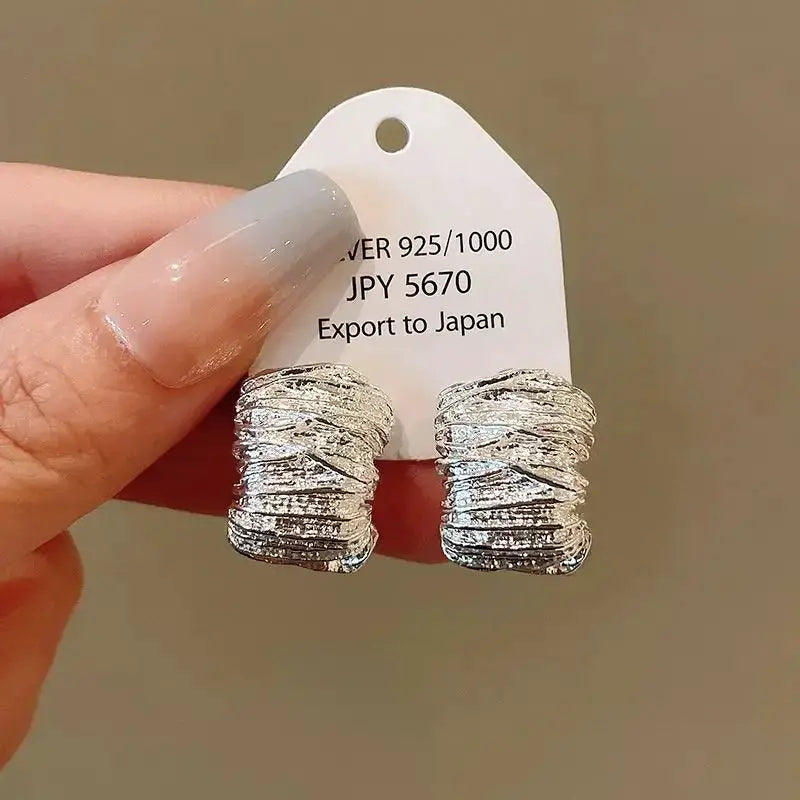 Punk geometric zinc alloy stud earrings in silver with textured irregular grain; 2-piece set
