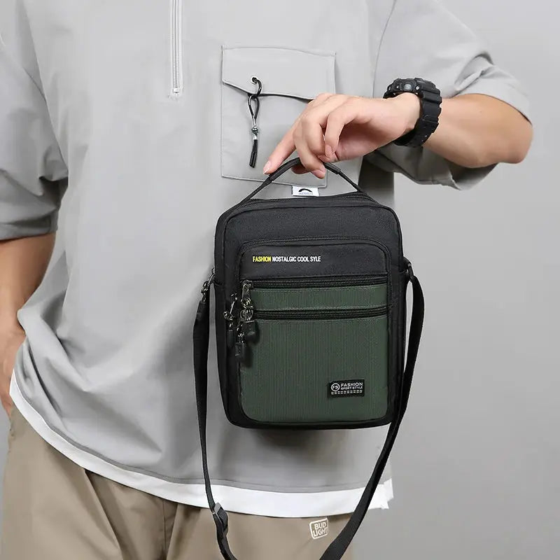 Men's crossbody bag, black and olive-green two-tone with multiple pockets