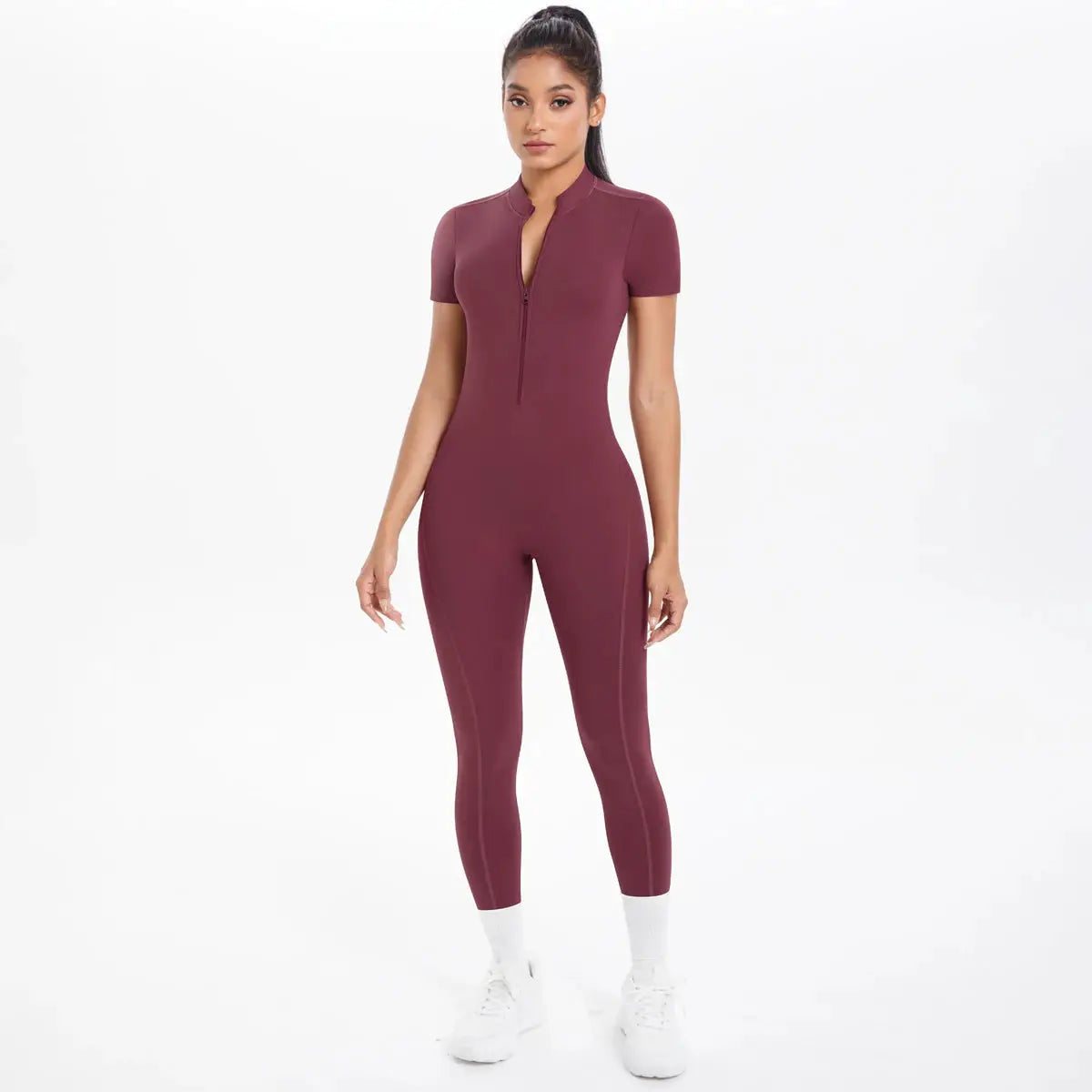 Women's maroon short-sleeve fitness jumpsuit with front half-zip, one-piece gym yoga bodysuit.