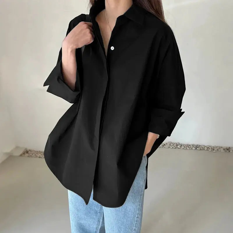 Oversized black shirt with turn-down collar and long sleeves